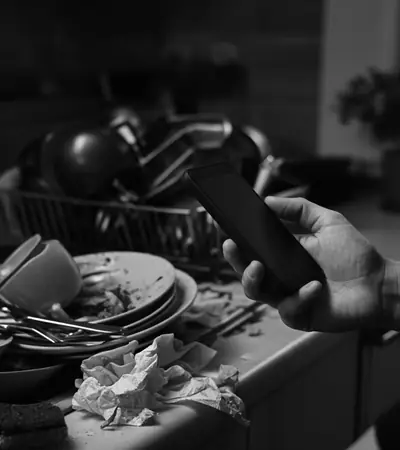 Sink piled with dirty dishes